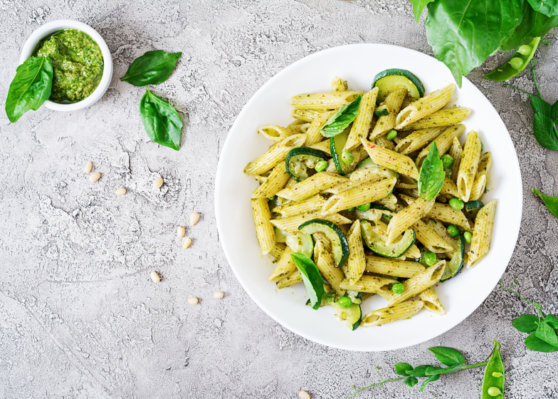 Penne pasta with spinach and zucchini in a creamy sauce